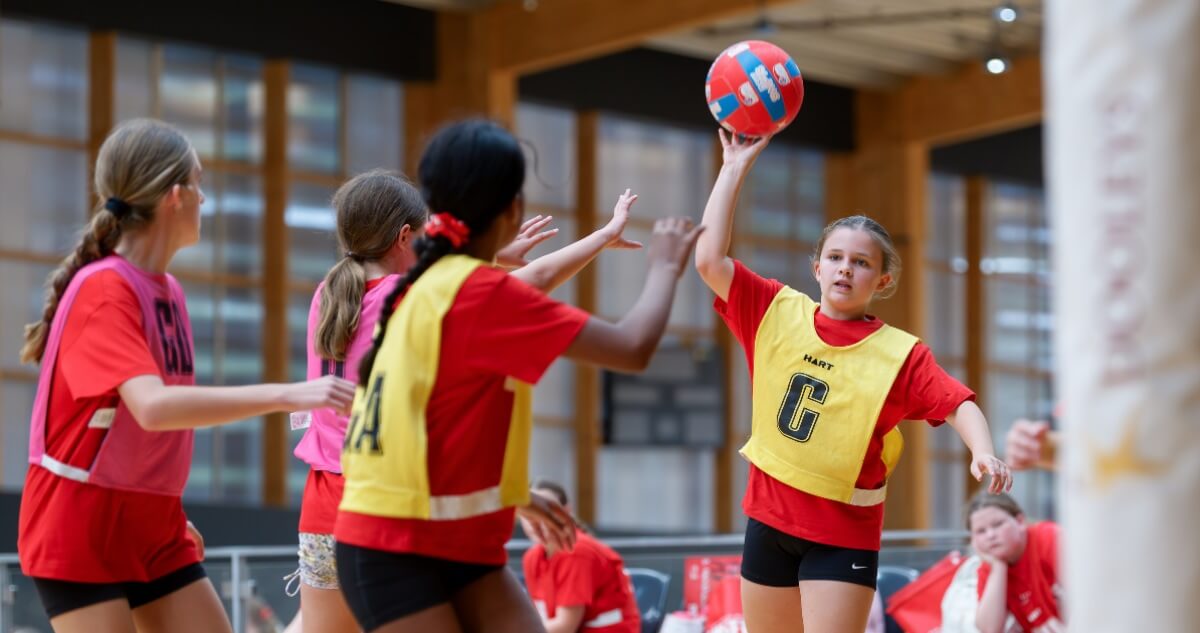 Kids play netball
